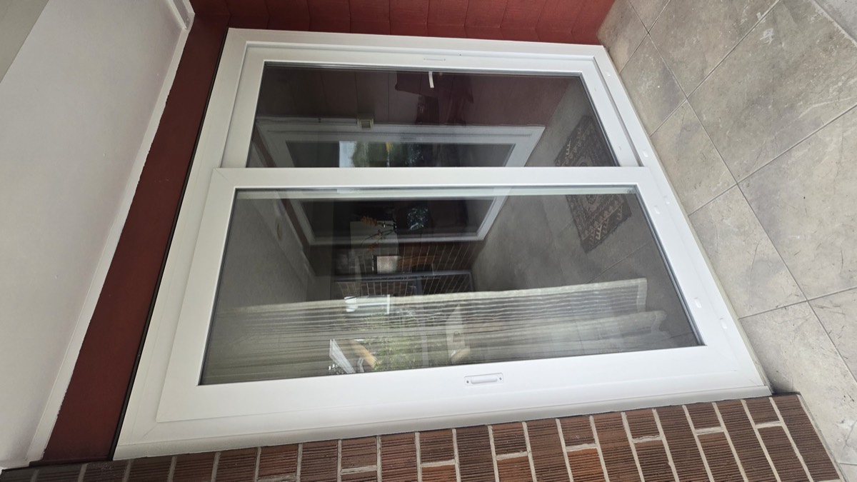 White uPVC sliding patio doors fitted to a brick home